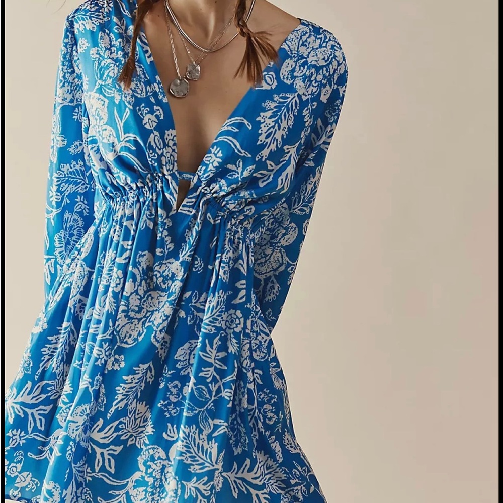 Free People Soli Mini Dress. Cut out detail in back. Effortless, pull-on style.